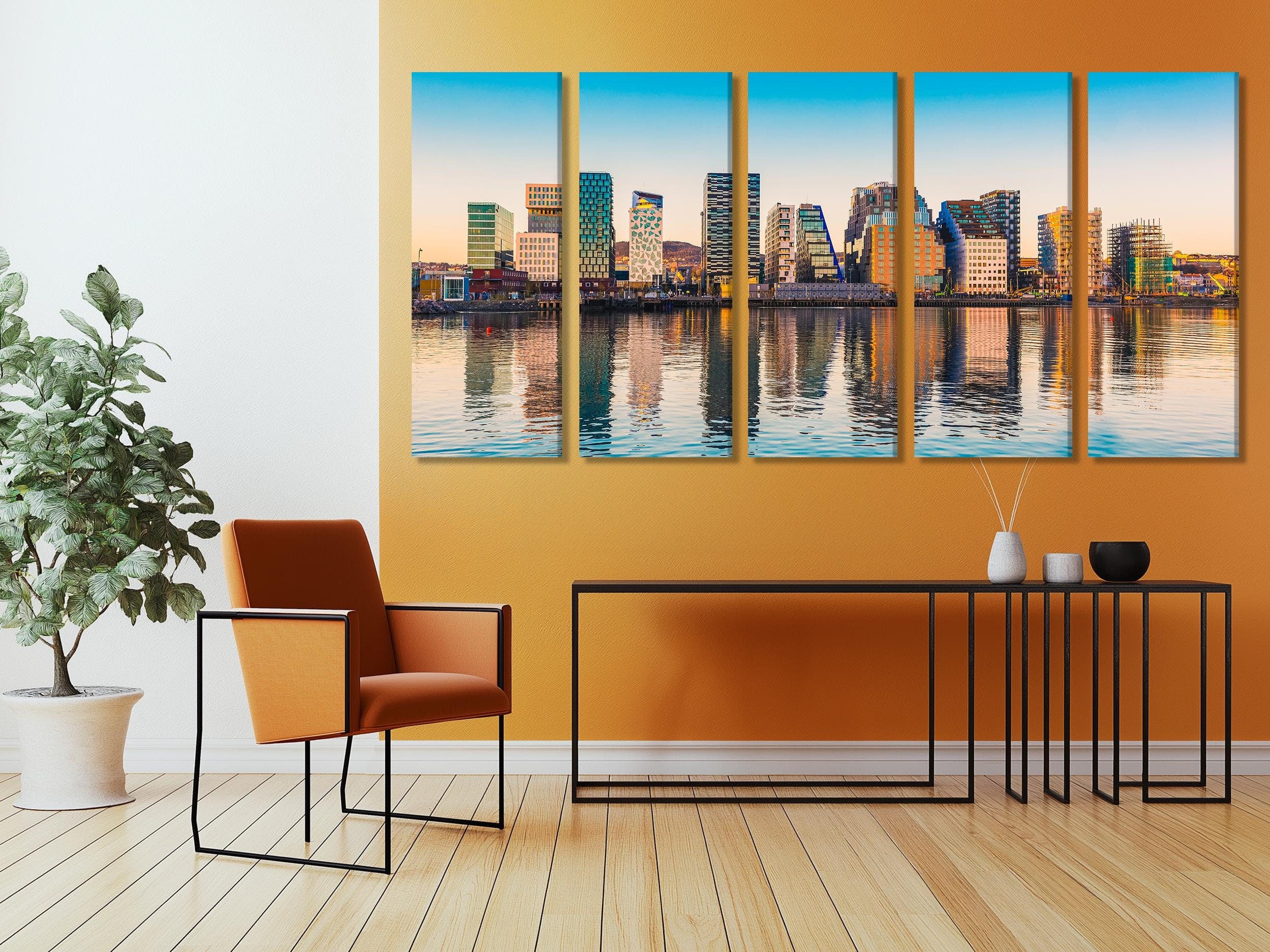 Modern cityscape artwork exhibiting geometric building designs, calm waters, and a warm sunset palette, ideal for infusing metropolitan elegance into any space.