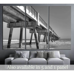 Fishing Pier in Jacksonville Beach, Florida №2498 Ready to Hang Canvas PrintThis canvas print features a black and white photograph of a pier extending into the sea, offering a perspective that leads the viewer's eye into the horizon. Its monochromatic to