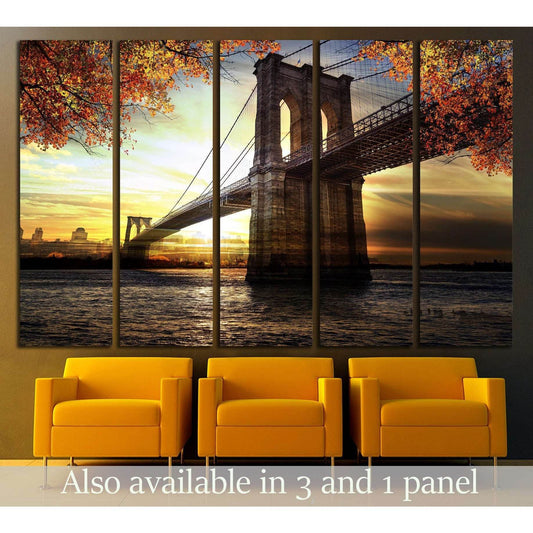 Autumn Sunset Brooklyn Bridge Canvas for Urban Home DecorThis canvas print showcases the Brooklyn Bridge at sunset, framed by the warm autumnal foliage. The sun's reflection on the water and the silhouette of the city skyline in the background add depth a