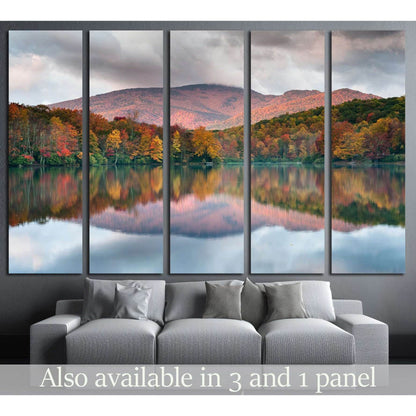 Blue Ridge Parkway Autumnal Mountain View Canvas Art for Modern OfficesThis canvas print depicts a peaceful lake reflecting the fiery hues of autumn trees and the soft purple of the mountain backdrop. The mirrored colors in the water create a sense of har