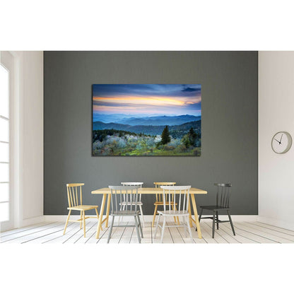 Calming Mountain Twilight Artwork for Spa Interior DesignThis canvas print captures a serene twilight scene over a layered mountain landscape, bathed in soft dusk light, ideal for creating a calming ambiance in spaces intended for relaxation or contemplat