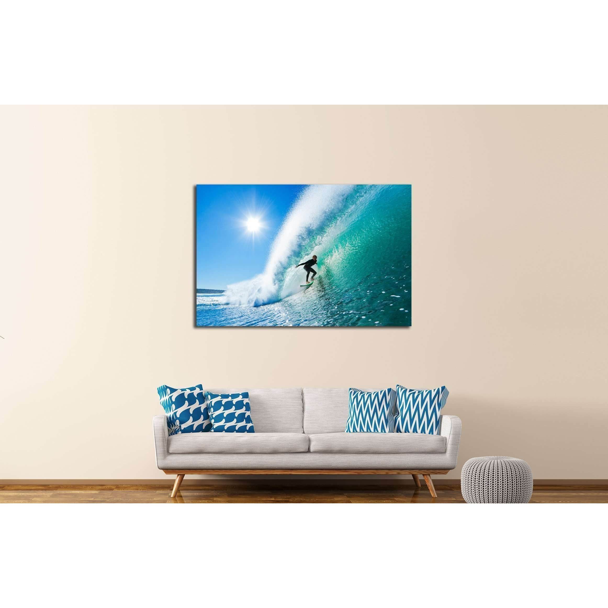 Dynamic Surfer Wave Triptych Canvas for Beach House DecorThis triptych canvas print captures a surfer skillfully navigating a towering wave, with the sun shining brightly in a clear blue sky. The dynamic composition and vivid colors convey the excitement