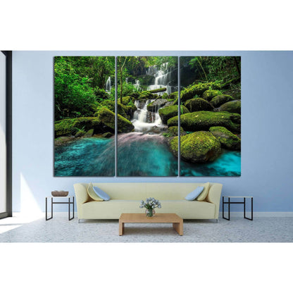 Thailand Forest Waterfall Canvas Art for Nature-Inspired SpacesThis canvas print showcases a verdant waterfall oasis, where the water flows over moss-covered rocks in a tranquil forest. The lush greenery and serene water create a refreshing and rejuvenati