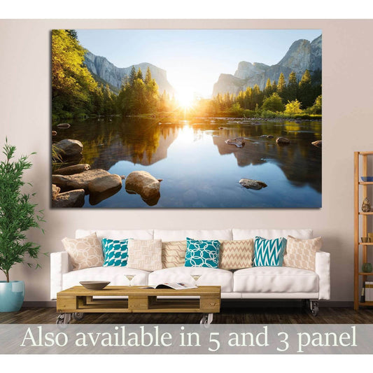 Granite Cliffs and River Reflection Wall Decor - Yosemite Landscape ArtworkThis canvas print offers a stunning portrayal of Yosemite Valley at sunrise, with the sun's first rays illuminating the granite cliffs and casting reflections on the calm waters of